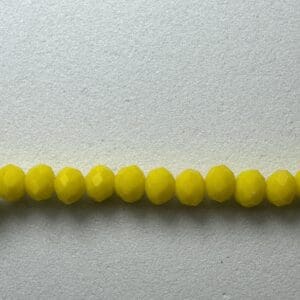 Row of bright yellow glass beads.