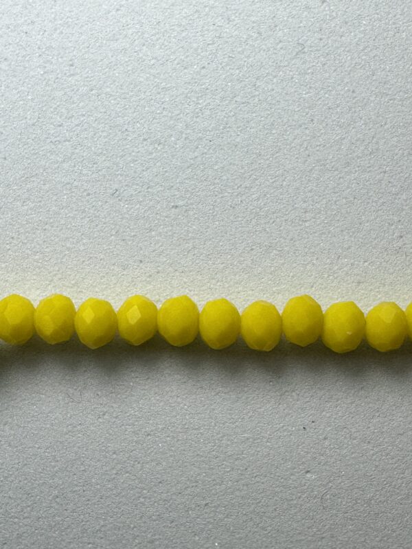 Row of bright yellow glass beads.