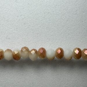 Row of iridescent brown and white beads.