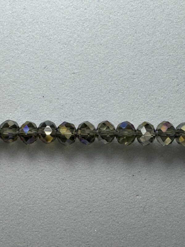 Row of iridescent brown glass beads.