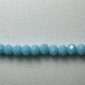 Row of blue faceted glass beads.