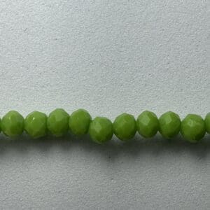 Row of green faceted glass beads.