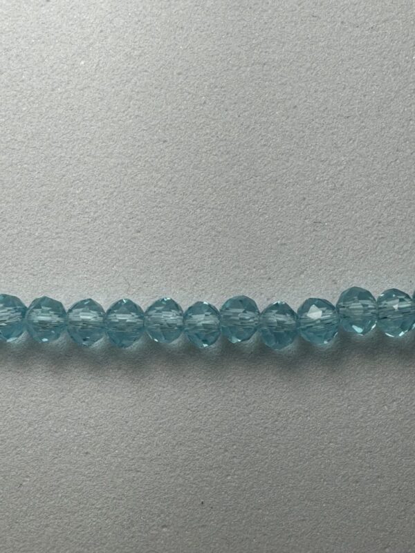 Row of light blue glass beads.