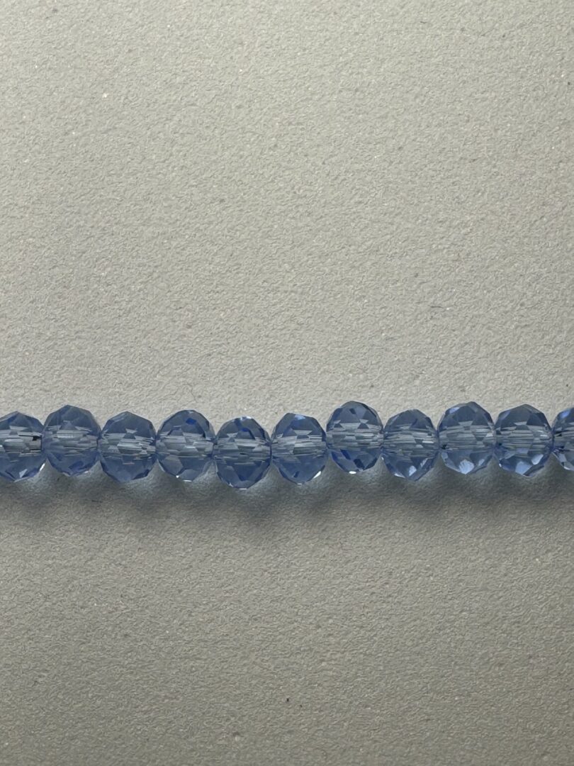 Row of light blue glass beads.