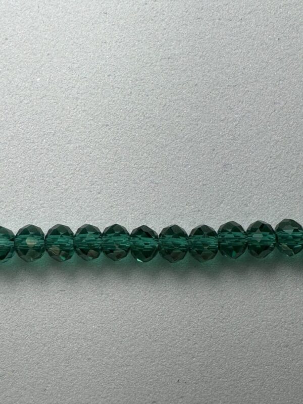 Row of dark green crystal beads.