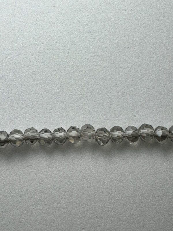 Row of smoky gray glass beads.