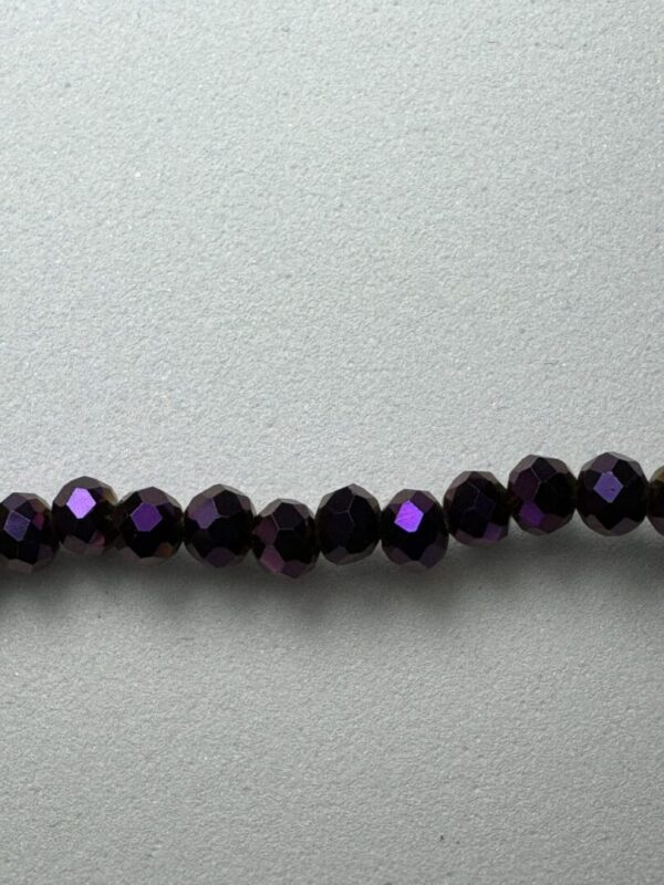 Row of iridescent purple beads.