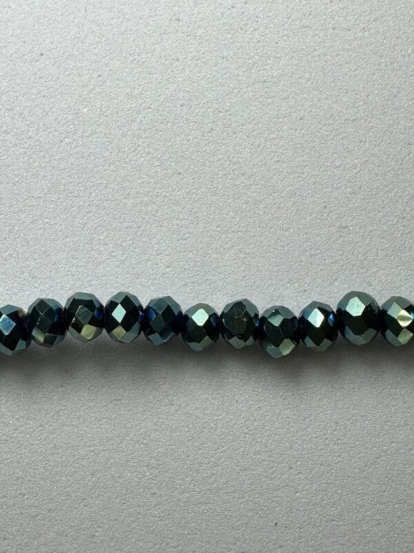 Row of dark green iridescent beads.