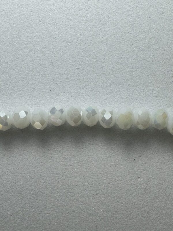 Row of iridescent white beads.