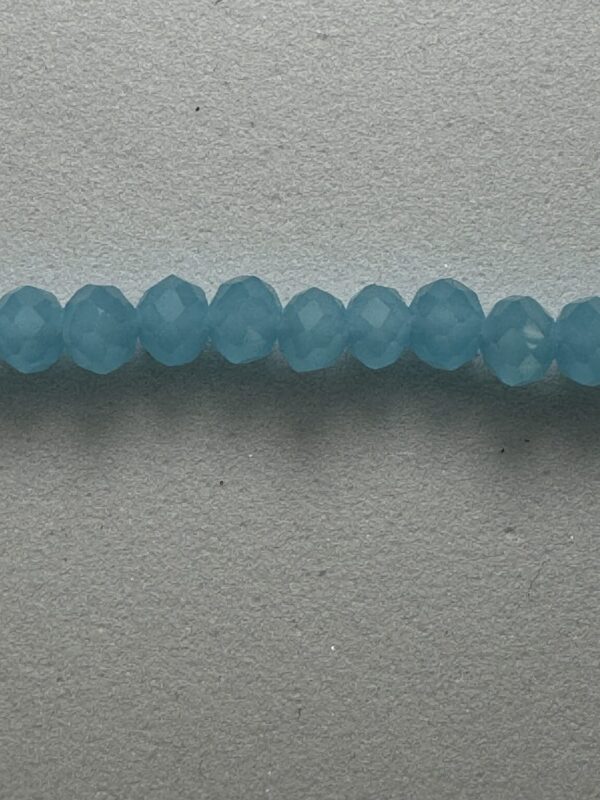 Row of light blue faceted beads.