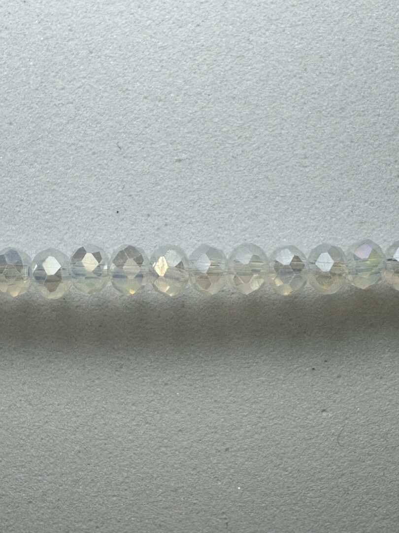 Row of iridescent glass beads.