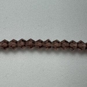 Brown faceted glass beads strand.