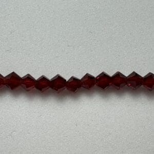 Dark red crystal beads strand.