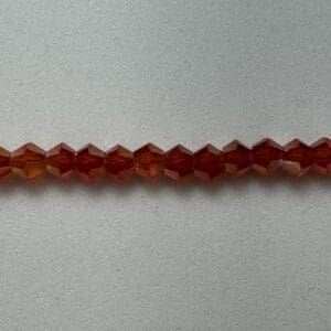 Amber glass beads, jewel-toned row.