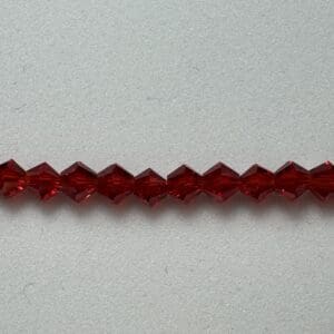 Red crystal beads in a row.