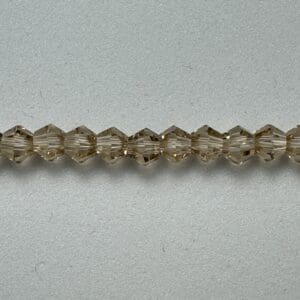 Brown faceted glass beads strand.