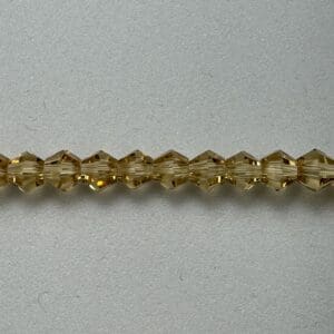 Amber glass beads on white background.