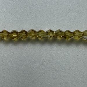 Here's an alt tag for the image: Olive green crystal beads strand.