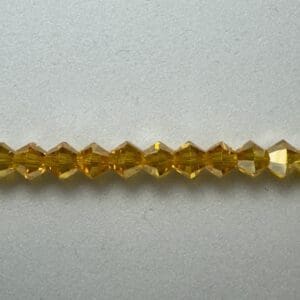 Amber faceted glass beads strand.