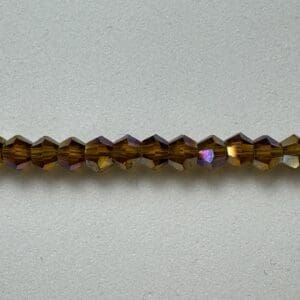 Brown iridescent glass beads strand.