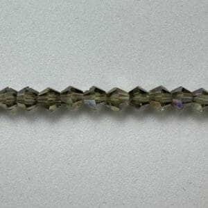 Row of dark gray crystal beads.