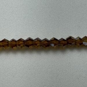 Brown faceted glass beads strand.