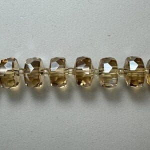 Brown faceted glass beads strand.