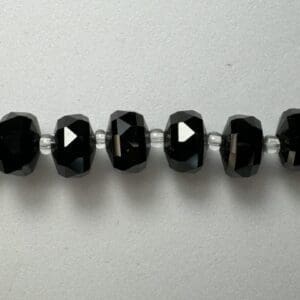 Black crystal beads necklace detail.