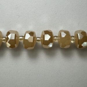Gold faceted beads necklace detail.