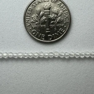 US dime and clear glass beads.