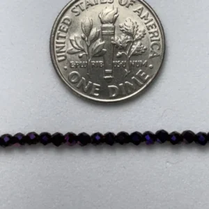 Dime and dark purple beads.