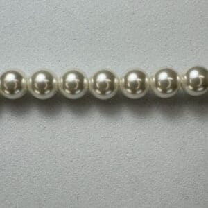 Row of creamy white pearl beads.