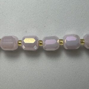 Lavender glass beads with gold spacers.