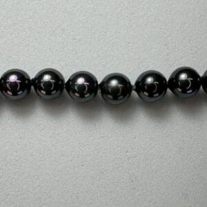 Black pearl necklace detail.