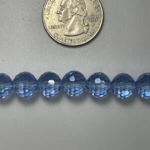 Light blue faceted glass beads, size comparison.