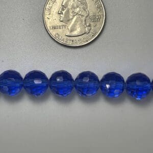 Royal blue glass beads with quarter.