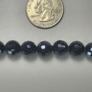 Dark blue faceted glass beads.