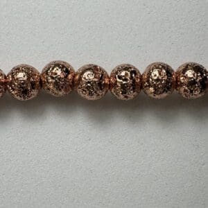 Rose gold lava rock beads strand.