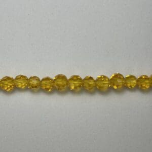 Tiny golden faceted round bead strand