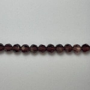 Dark brown faceted glass beads strand.