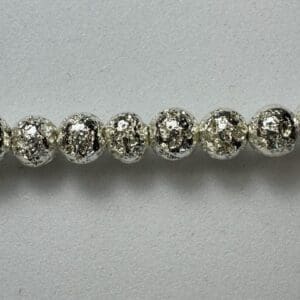Silver textured bead strand jewelry.