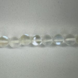 Row of translucent gemstone beads.
