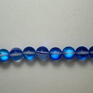 Row of frosted blue glass beads.