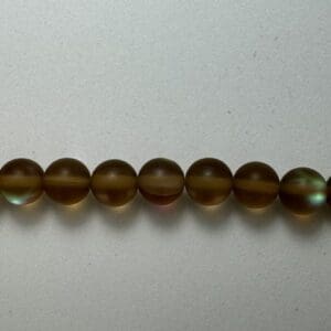 Brown iridescent glass beads strand.