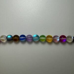Row of colorful iridescent glass beads.