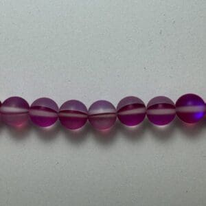 Row of purple glass beads.
