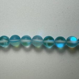 Row of light blue glass beads.