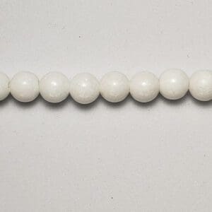Row of white round beads.