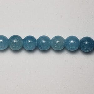 Row of light blue gemstone beads.