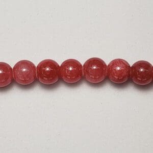 Red gemstone beads strand.